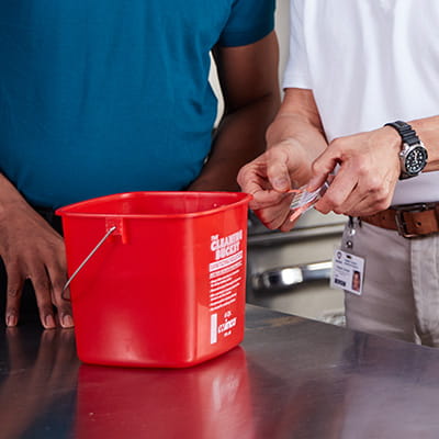 Red bucket in foodservice kitchen